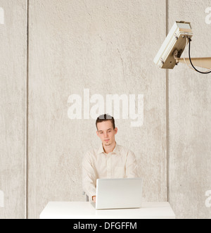 Conceptual image of internet privacy and computer surveillance, man being watched Stock Photo