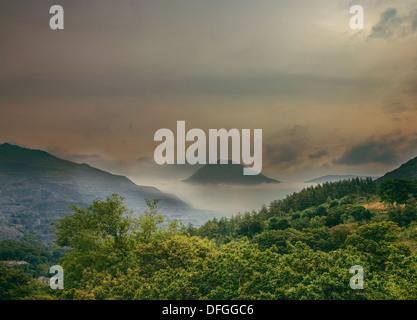 Misty Sunset in mountains Stock Photo