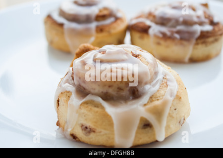 Sweet rolls on a white plate with soft, natural light. Stock Photo