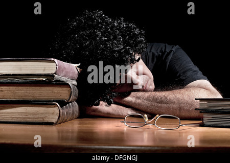 Man fell asleep on his desk Stock Photo