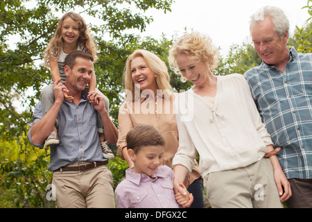 Multi-generation family walking together outdoors Stock Photo