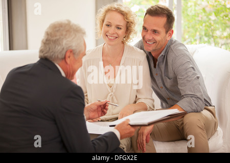 Financial advisor talking with clients Stock Photo