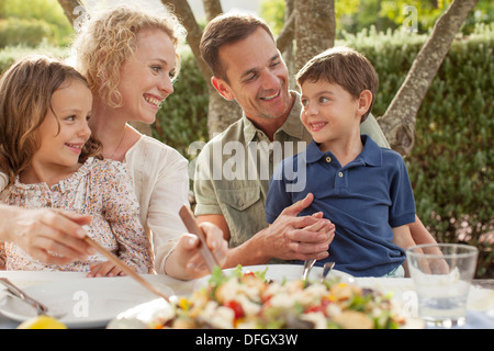 Family eating outdoors Stock Photo