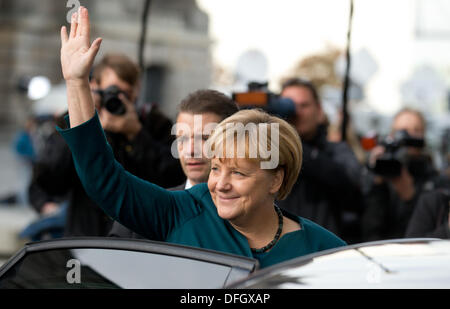 Berlin, Germany. 04th Oct, 2013. German Chancellor Angela Merkel leaves the preliminary talks at the parliamentary association in Berlin, Germany, 04 October 2013. CDU and SPD are holding talks to see if a grand coalition is possible. Photo: Kay Nietfeld/dpa/Alamy Live News Stock Photo