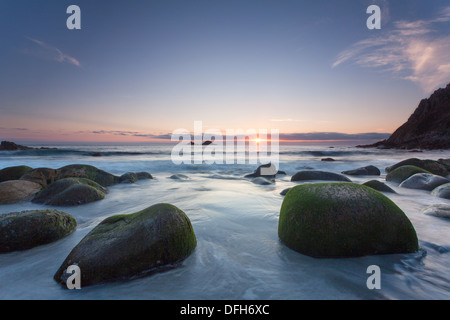 Sunset at Porth Nanven beach looking out to sea towards the Brisons, Cornwall, UK Stock Photo
