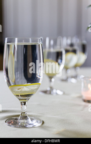 Water Glasses with Lemon Slices in a row Stock Photo