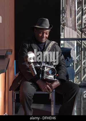 Louis Mendes, a New York City photographer known for carrying
