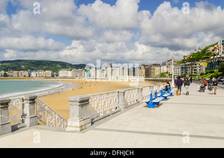 People walking along the Promenade La Concha, San Sebastian, Spain Stock Photo