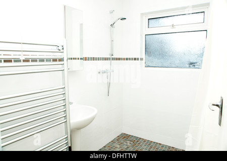 A specially adapted wet room shower / bathroom with non slip tiles used for the flooring suitable for disabled people Stock Photo