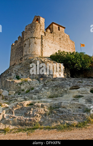 Castell Santa Creu stands on a rocky outcrop overlooking the old town of Calafell in the Catalan region of Spain. Stock Photo