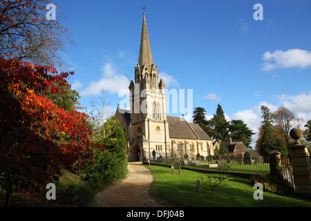 A church and steeple with trees in autumn colours. Stock Photo