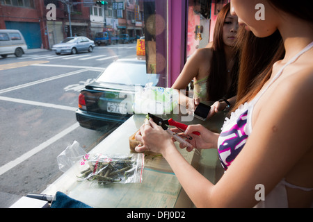 Betelnut girl in a betelnut booth in Taiwan Stock Photo