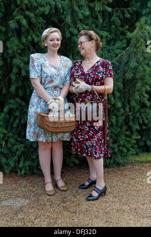Georgina left with mother Lynsey in authentic  1940s fashion recreate the atmosphere of the time at Hughenden Manor Stock Photo