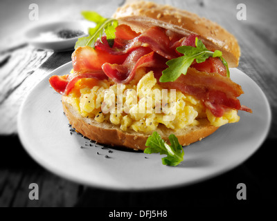 Crispy backon and scrambled eggs on a bagel Stock Photo