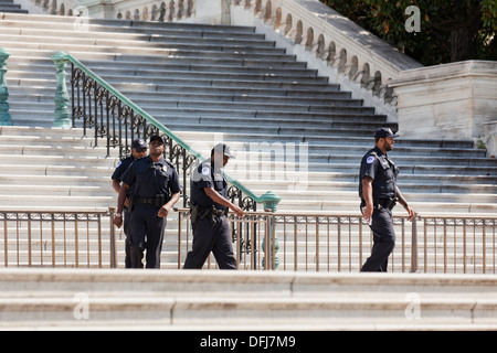US Capitol Police officers walking down steps of the Capitol building ...