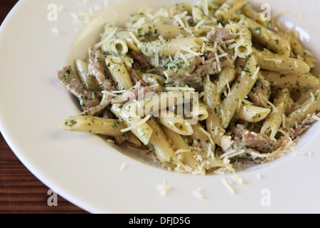 A serving of Penne pasta with herbs, beef and cheese Stock Photo