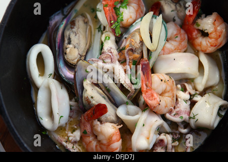 Seafood Bouillabaisse with shrimps, calamari and mussel Stock Photo