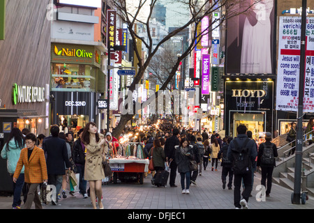 Busy pedestrianised street in Myeongdong in the evening, Seoul, Korea Stock Photo