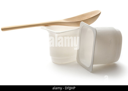 Empty plastic yoghurt pots with spoon Stock Photo