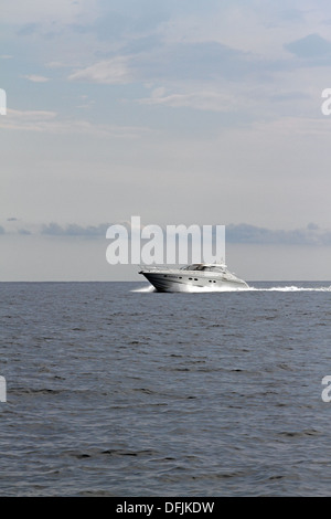Motorboat speeding along in the med Stock Photo - Alamy