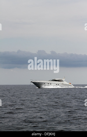 Motorboat speeding along in the med Stock Photo - Alamy