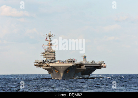 US Navy aircraft carrier USS George Washington moves into formation during a training exercise October 3, 2013 along the Sea of Japan. Stock Photo