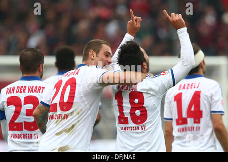 Nuremberg, Germany. 06th Oct, 2013. Hamburg's Tolgay Arslan (2-R) celebrates his 5-0 goal with Raffael van der Vaart, Pierre-Michel Lasogga and Milan Badelj (L-R) during the German Bundesliga soccer match between 1. FC Nuremberg and Hamburger SV at the Grundig Stadium in Nuremberg, Germany, 06 October 2013. Photo: DANIEL KARMANN (ATTENTION: Due to the accreditation guidelines, the DFL only permits the publication and utilisation of up to 15 pictures per match on the internet and in online media during the match.)/dpa/Alamy Live News Stock Photo