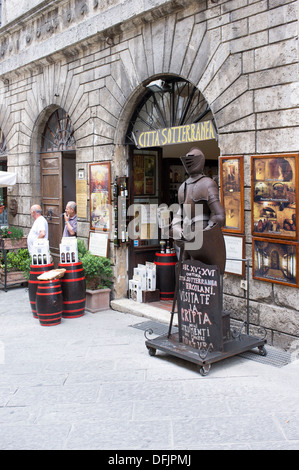 Suit of Armour and advertising boards outside of a shop in Montepulciano Tuscany Italy Stock Photo