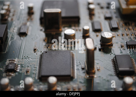 The computer electronic card with chips, microprocessors, transistors, explorers and other electronic parts. Stock Photo