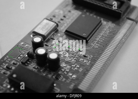 The computer electronic card with chips, microprocessors, transistors, explorers and other electronic parts. Stock Photo