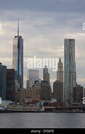 Freedom Tower construction and Gehry Tower in Manhattan as seen from across the East River in Brooklyn, NY, USA. Stock Photo