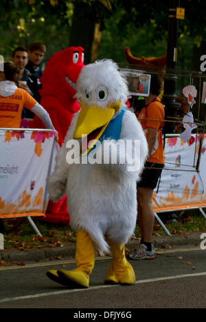 6th October 2013. Hyde Park London, UK.  A participant running for charity is  dressed in a duck costume as  a record number of runners estimated at 16,000 took part in the Royal Parks Foundation half marathon race with runners dressed in animal and comic costumes to raise money for more than 300 charities Stock Photo