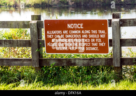 warning signs on a wood in a park Stock Photo - Alamy