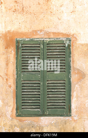 Green shuttered window, closed Stock Photo