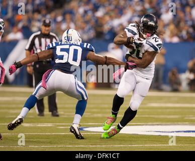 Indianapolis, Ohio, USA. 6th Oct, 2013. October 06, 2013: Seattle Seahawks running back Marshawn Lynch (24) breaks the tackle from Indianapolis Colts inside linebacker Jerrell Freeman (50 in the first half during the NFL game between the Seattle Seahawks and the Indianapolis Colts at Lucas Oil Stadium in Indianapolis, IN. Credit:  csm/Alamy Live News Stock Photo