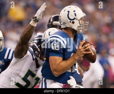 Indianapolis, Ohio, USA. 6th Oct, 2013. October 06, 2013: Indianapolis Colts quarterback Andrew Luck (12) is sacked by Seattle Seahawks defensive end Bruce Irvin (51) in the first half during the NFL game between the Seattle Seahawks and the Indianapolis Colts at Lucas Oil Stadium in Indianapolis, IN. Credit:  csm/Alamy Live News Stock Photo