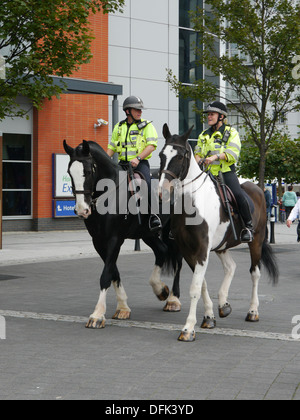Two mounted police officers patrol Gunwharf Quays in Portsmouth, hamsphire Stock Photo