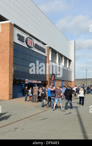 Fans outside the DW Stadium, home of Wigan Athletic Football Club and Wigan Warriors Rugby League FC. Stock Photo