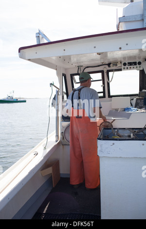 Lobsterman Eric Emmons on lobster boat. ME Maine New England Stock Photo