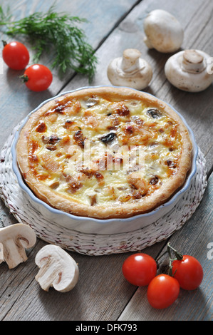 Traditional french quiche pie with chicken and mushroom on a plate Stock Photo
