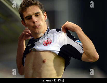 Freiburg, Germany. 06th Oct, 2013. Frankfurt's Johannes Flum puts on his shirt during the German Bundesliga soccer match between SC Freiburg and Eintracht Frankfurt at Mage Solar Stadium in Freiburg, Germany, 06 October 2013. Photo: PATRICK SEEGER/dpa/Alamy Live News Stock Photo