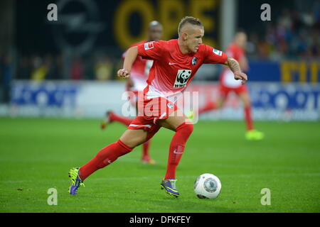 Freiburg, Germany. 06th Oct, 2013. Freiburg's Jonathan Schmid plays the ball during the German Bundesliga soccer match between SC Freiburg and Eintracht Frankfurt at Mage Solar Stadium in Freiburg, Germany, 06 October 2013. Photo: PATRICK SEEGER/dpa/Alamy Live News Stock Photo