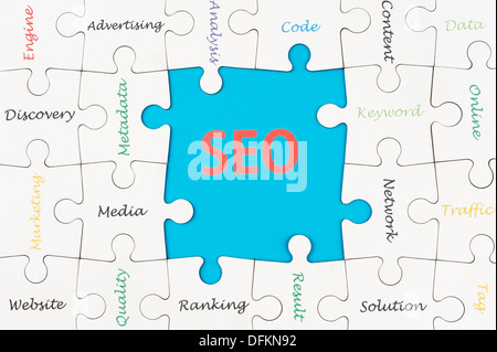 SEO concept words on group of jigsaw puzzle pieces Stock Photo