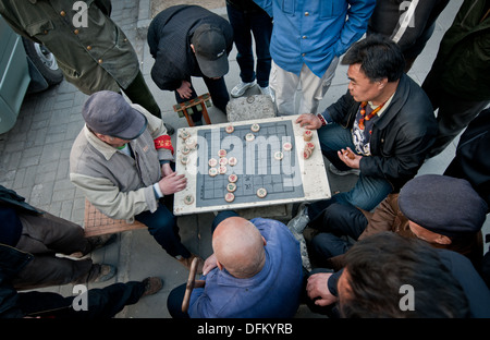 Chinese men playing Xiangqi also called Chinese chess in Beijing, China Stock Photo
