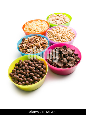 various kids cereals in plastic bowls on white background Stock Photo