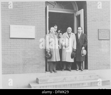 Photograph of a group of unidentified dignitaries in the doorway of the Lincon Museum at Ford's Theater in... 199494 Stock Photo