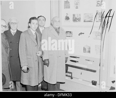 Photograph of a group of unidentified dignitaries in the Lincoln Museum at Ford's Theater, touring exhibits relating... 199495 Stock Photo