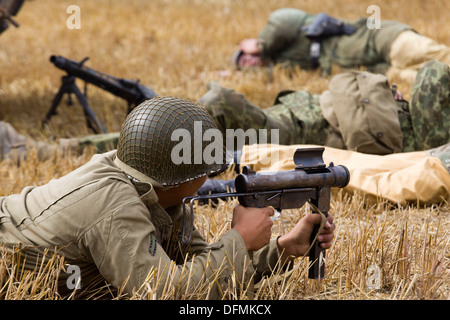 re-enactors in Battle at the Victory Show at Cosby USA Soldier Laying down covering fire over dead Bodies Stock Photo