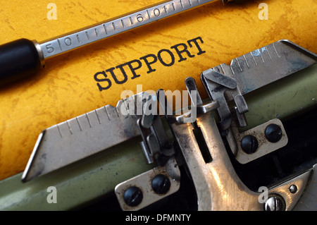 Support text on typewriter Stock Photo