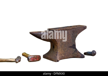 Cut Out. (L to R) Ball Peen Hammer, Small Sledge Hammer, Anvil and Rounding Tool used for Blacksmithing on white background. Stock Photo